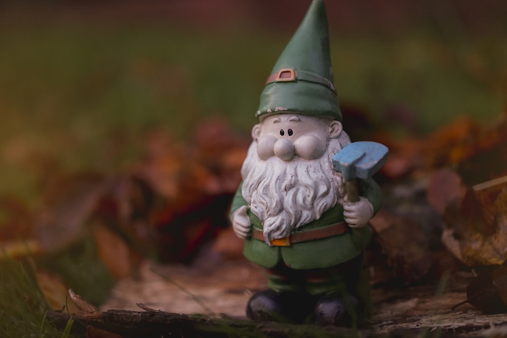 shallow focus photography of dwarf figurine