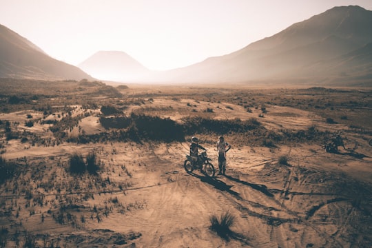 two person on motorcycle on rural land in Mount Bromo Indonesia