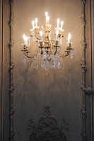 gold and white uplight chandelier