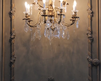 gold and white uplight chandelier