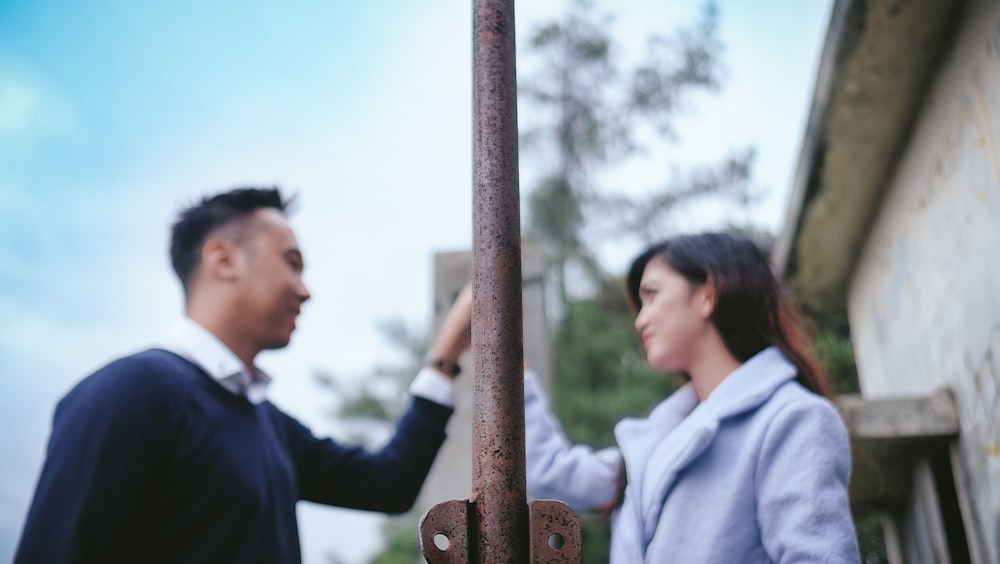 photo of man and woman holding hands