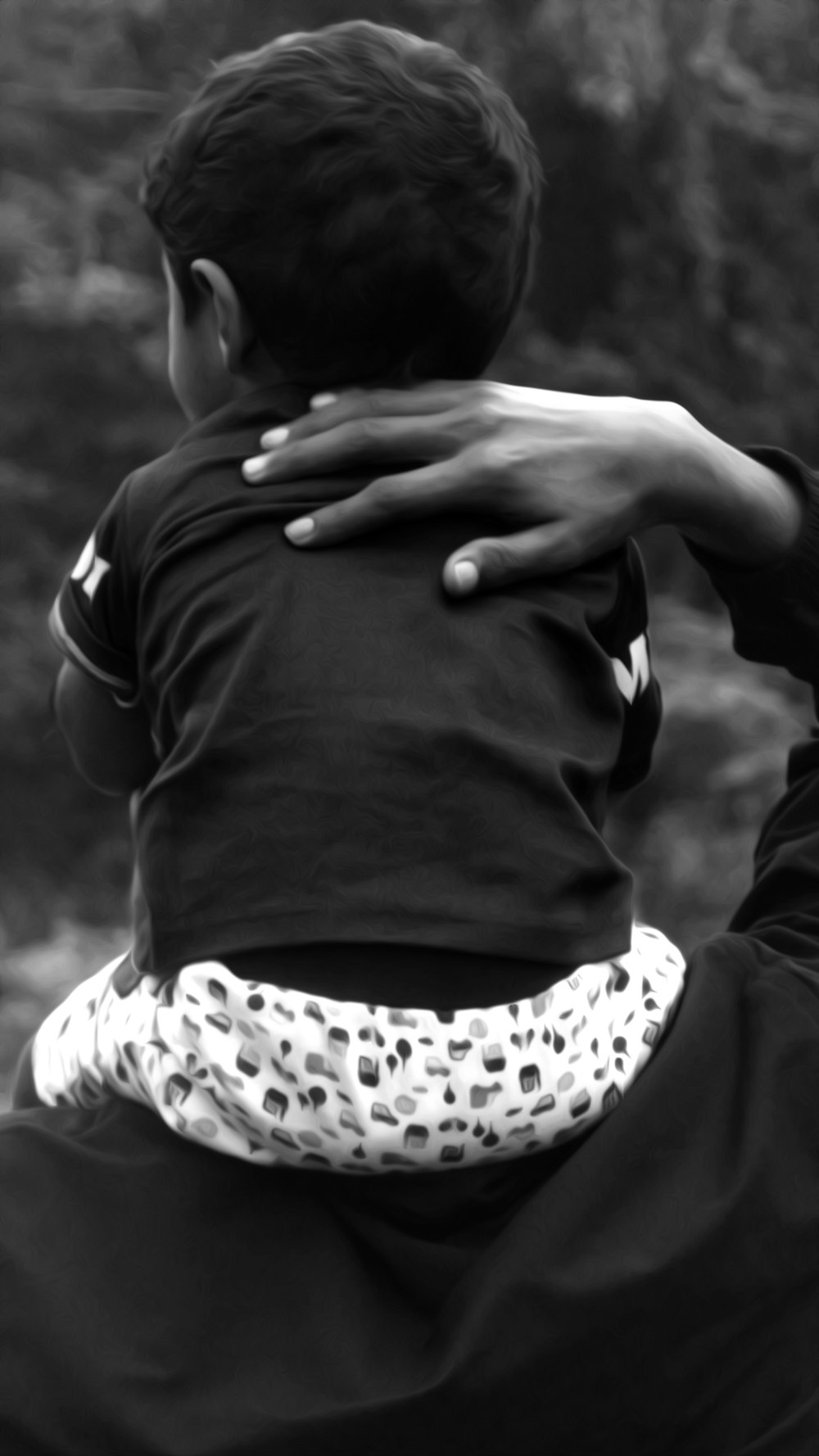 selective focus photo of boy wearing t-shirt and shorts