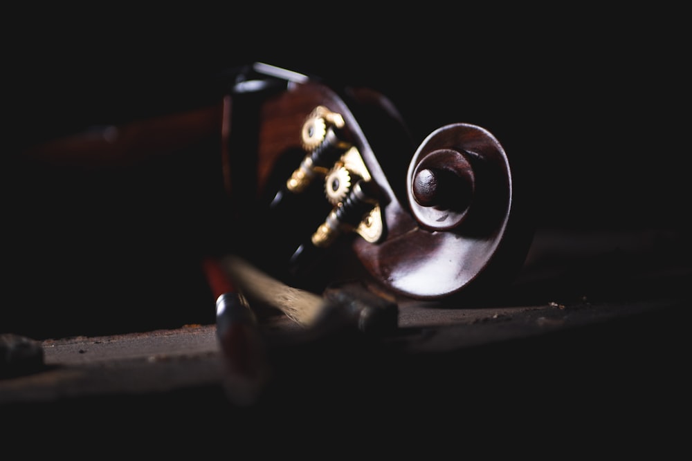 shallow focus photography of violin headstock