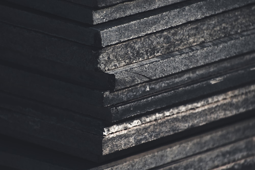 a stack of black boards stacked on top of each other