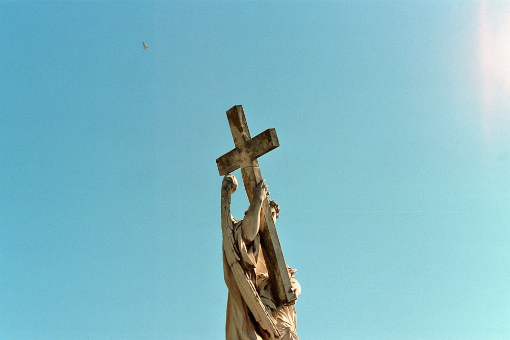 angel holding cross monument