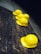 five yellow hard hats on gray surface