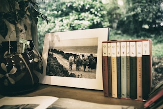 A rustic wooden picture frame filled with vibrant resin accents and a family photo.
