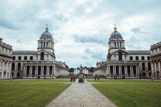 people walking near building during daytime in Naval College Gardens United Kingdom