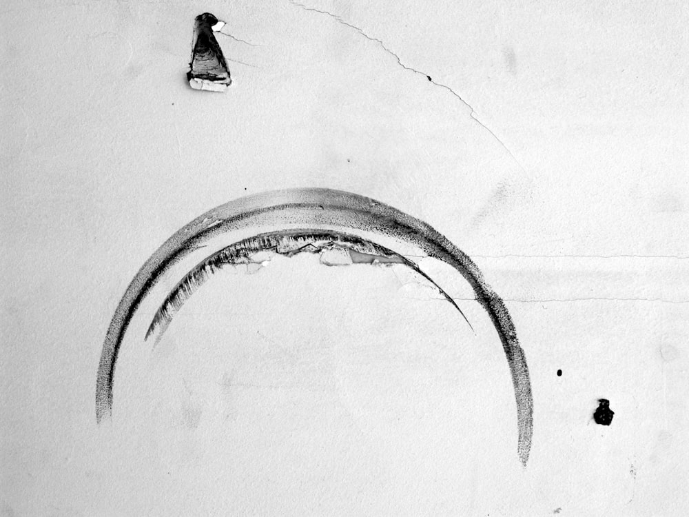 a black and white drawing of a curved object