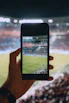 person taking photo using black smartphone