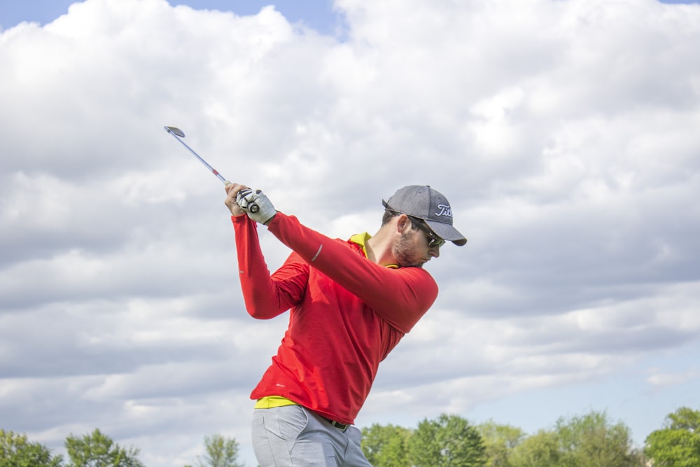 man holding golf club