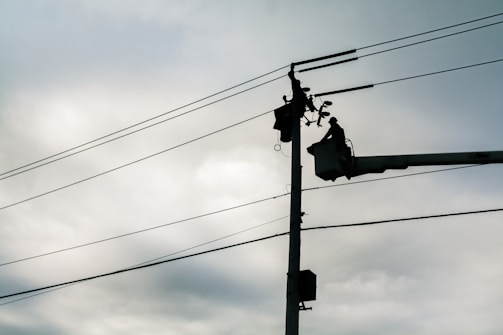 silhouette of street lamp during daytime
