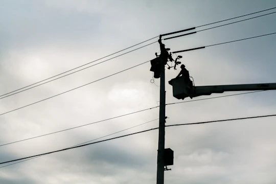 silhouette of street lamp during daytime
