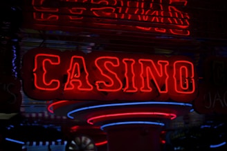 A sleek dark-themed casino interface glowing with neon lights, showcasing a grid of popular slot games.