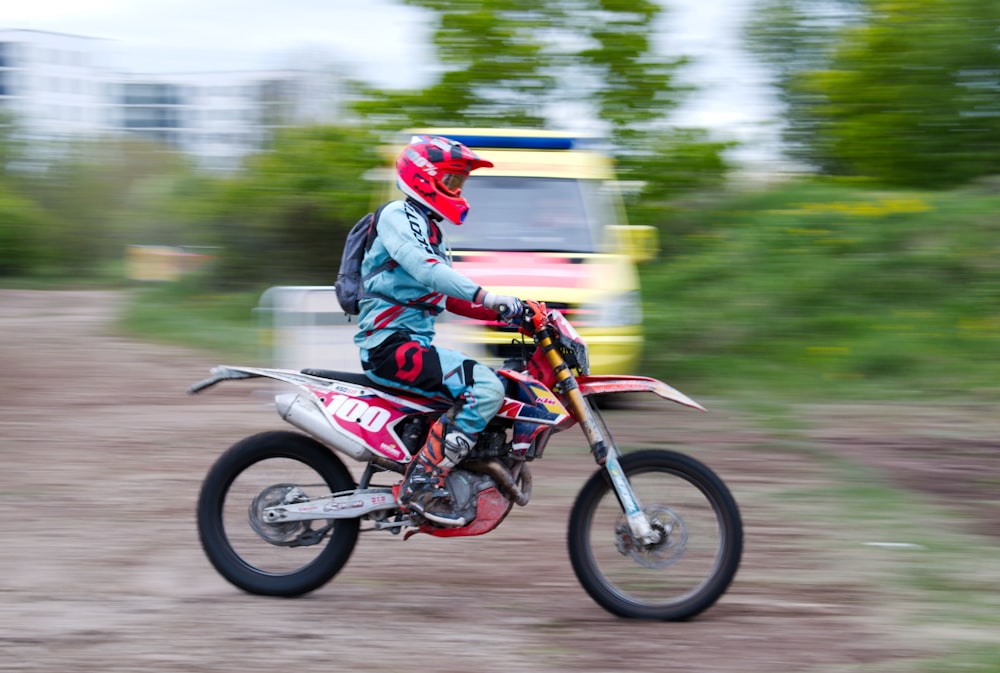 timelapse photography of man riding motocross dirt bike