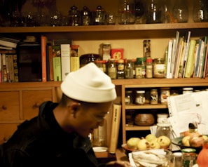 A cozy kitchen corner filled with jars of spices and cooking tools.