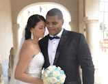 Bride and groom exchanging vows beneath the chapel’s elegant arch.