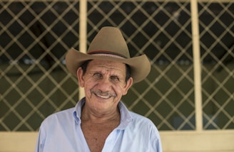 man wearing brown cowboy hat