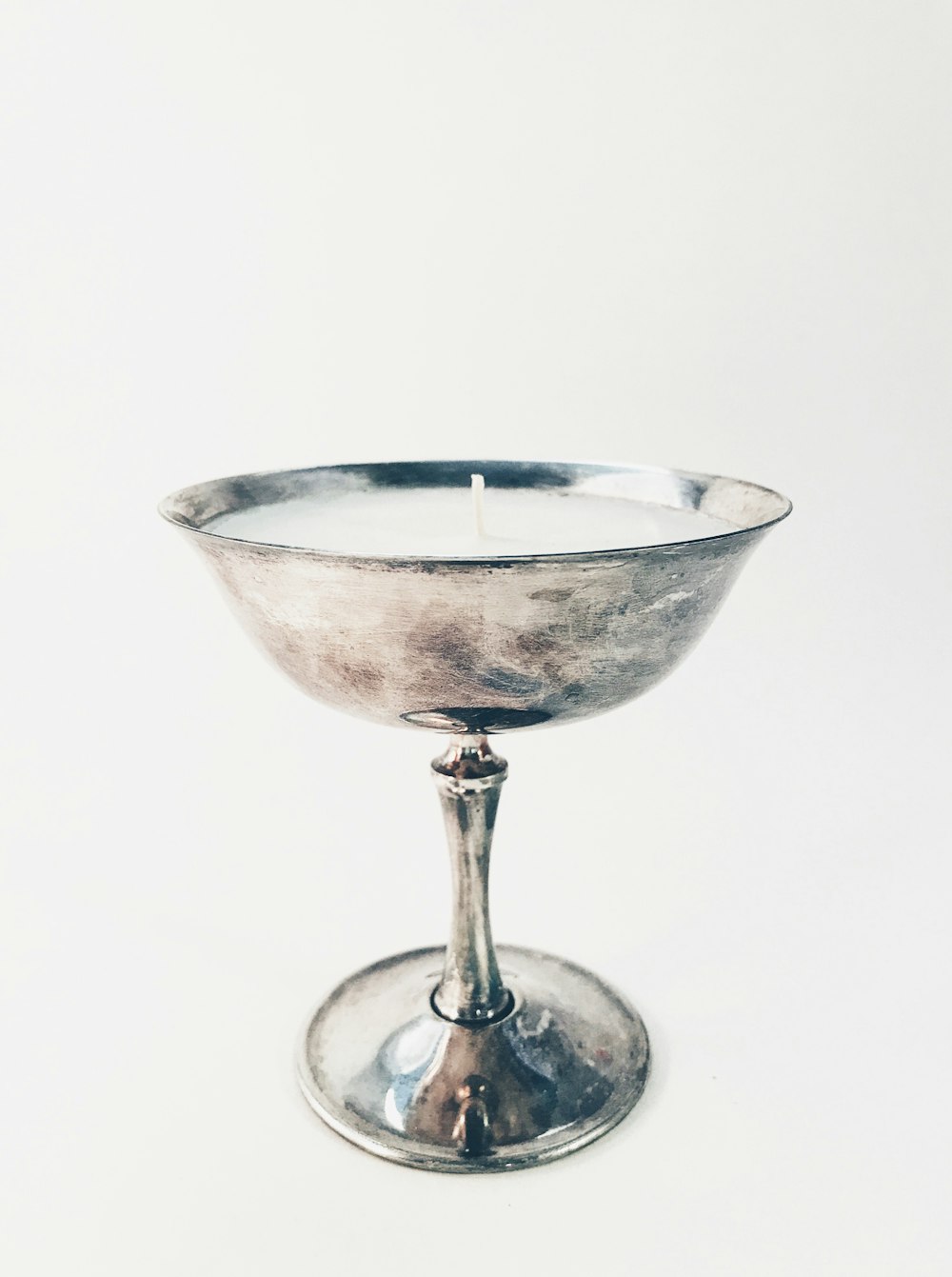 stainless steel candle holder with white candle