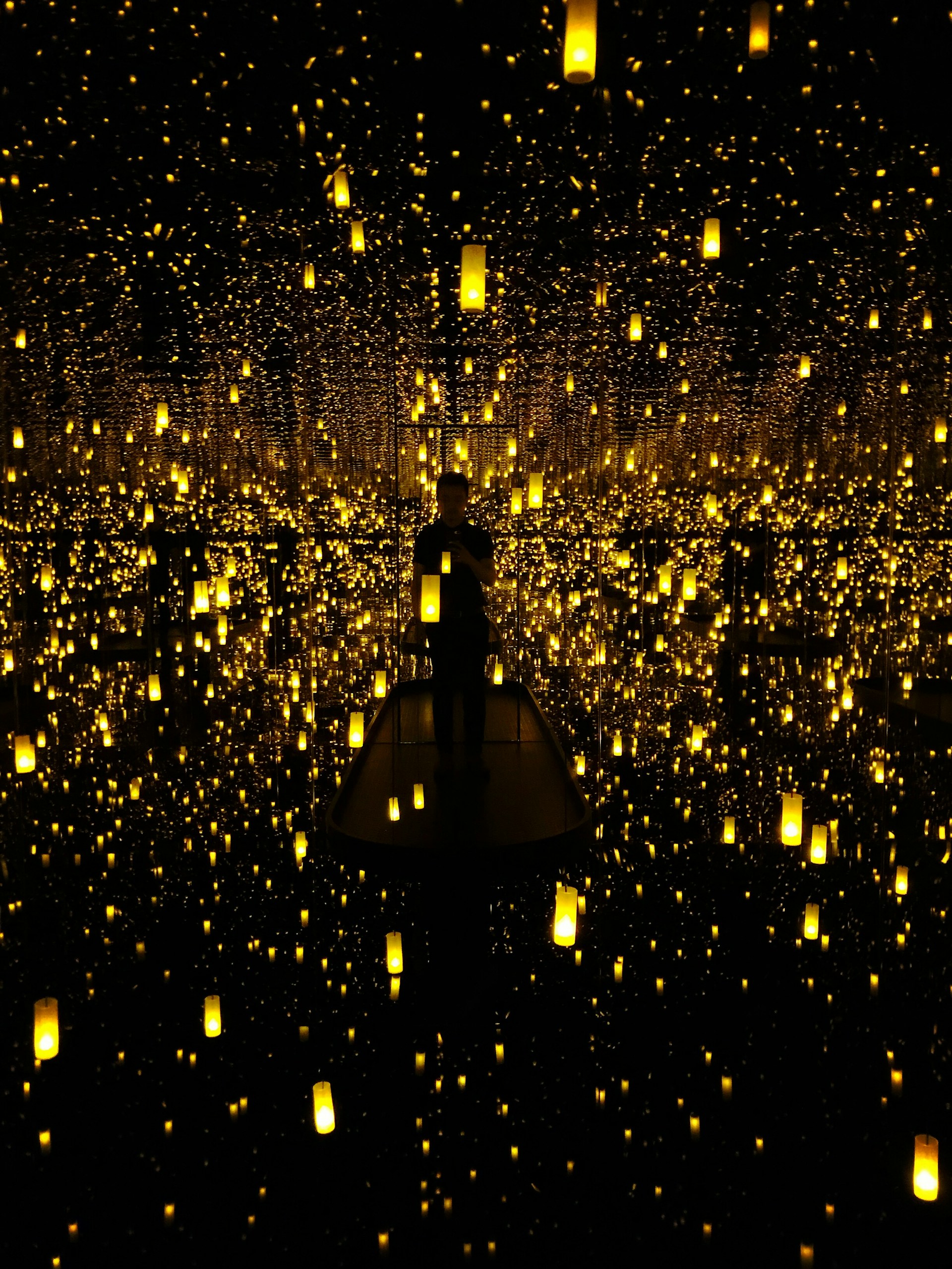 A tranquil installation blending light and shadow, inviting viewers to pause and breathe in a quiet moment.