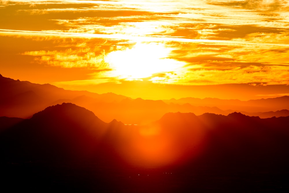 silhouette of mountains during sunset