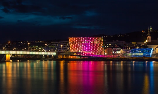 building near lake in Ars Electronica Center Austria