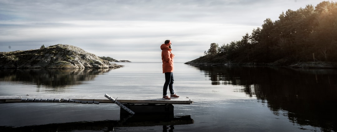 person standing on bridge