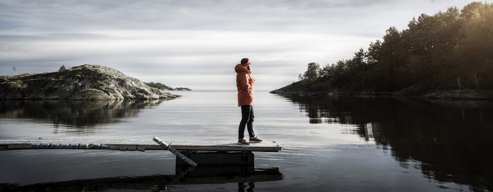 person standing on bridge