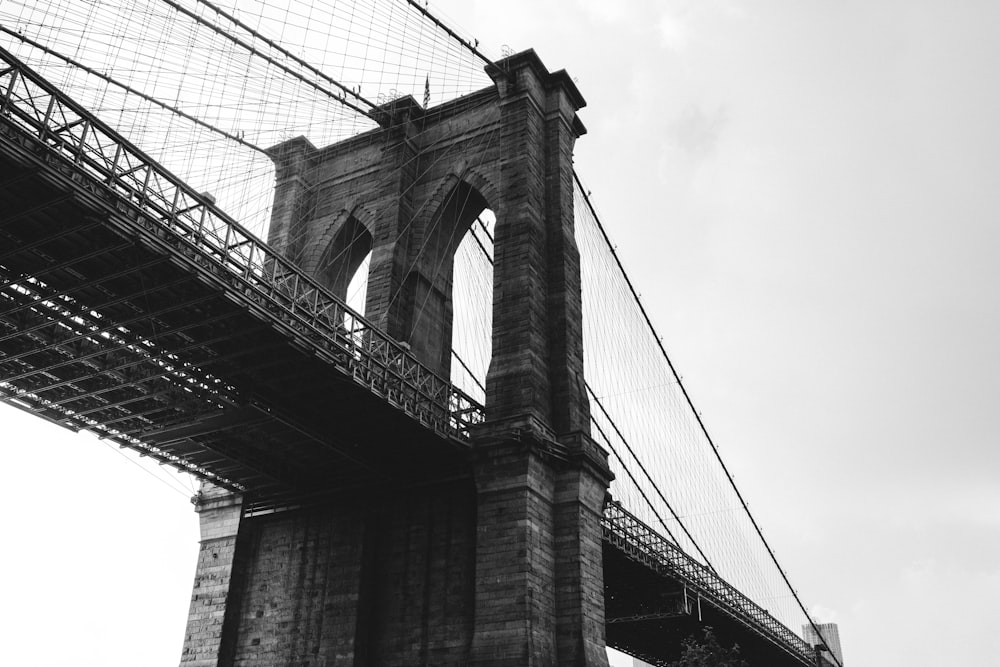 grayscale photo of concrete bridge