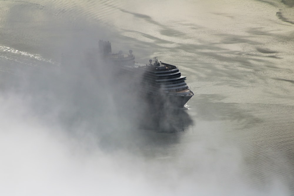 aerial photography of white cruise ship on water under white cloud