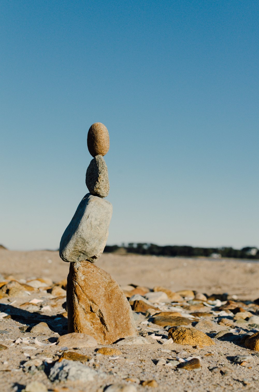 shallow focus photo gray balance stone