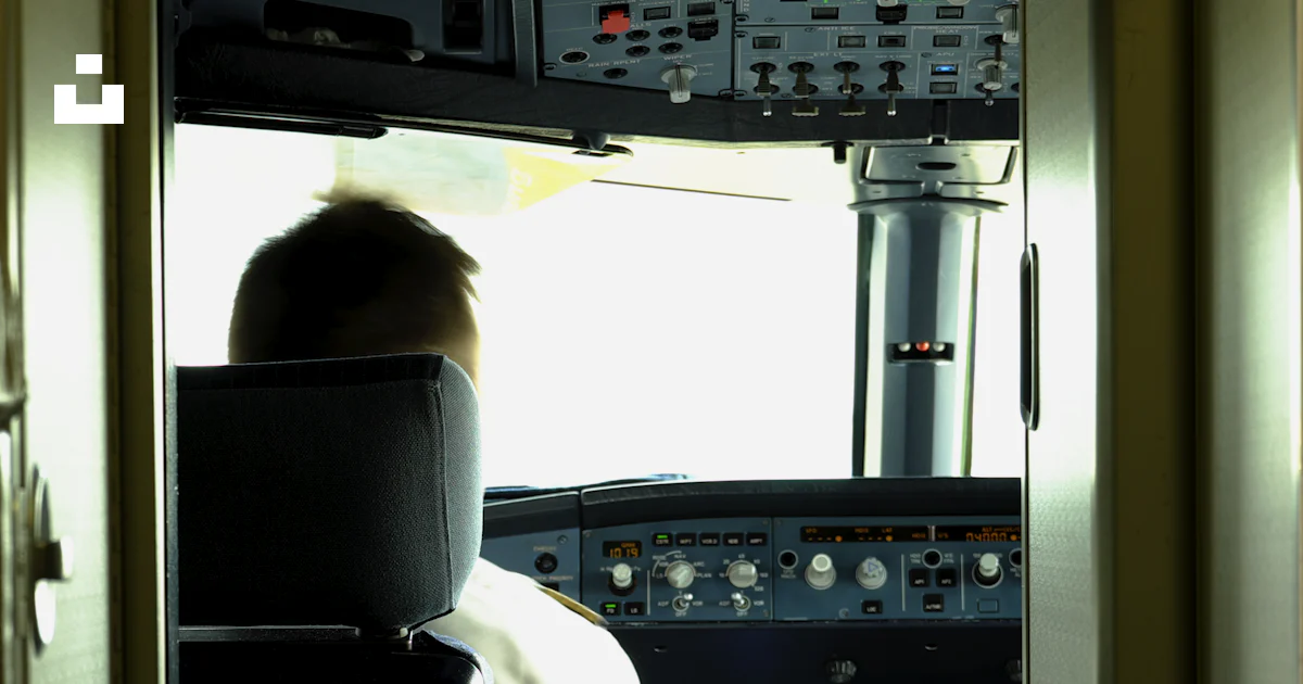 Man sitting in front of control panel photo – Free Dashboard Image on ...