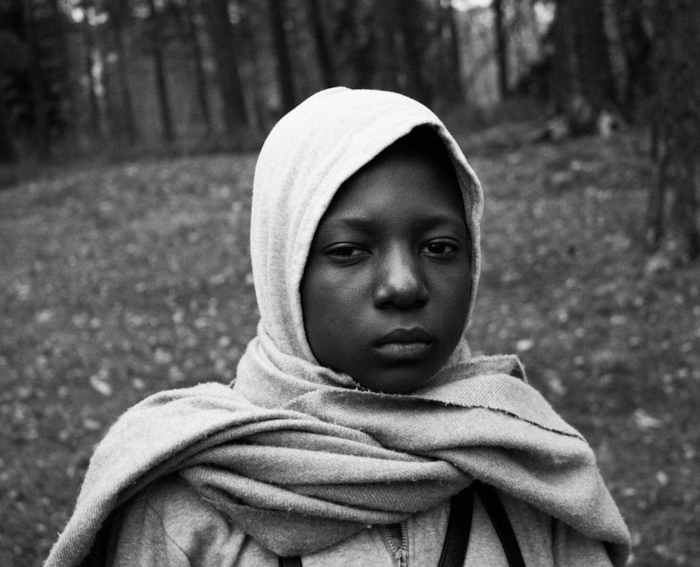 grayscale photo of child wearing hijab veil