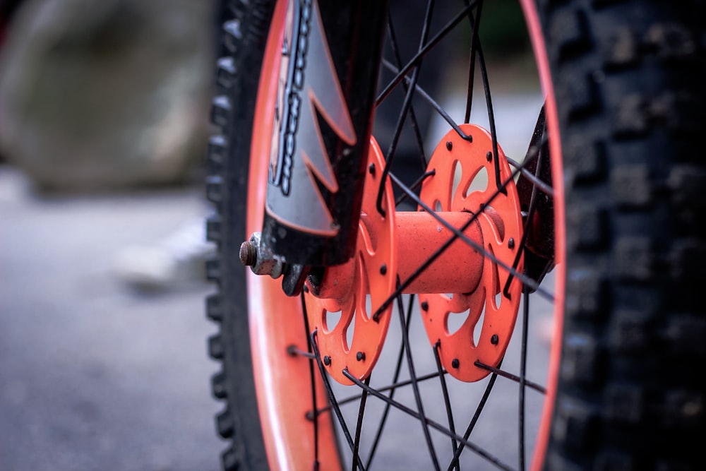 black and orange motorcycle wheel and tire