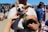 A happy pet owner with their dog at a community event.
