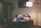 Man thoughtfully reading reviews on a laptop in a cozy room
