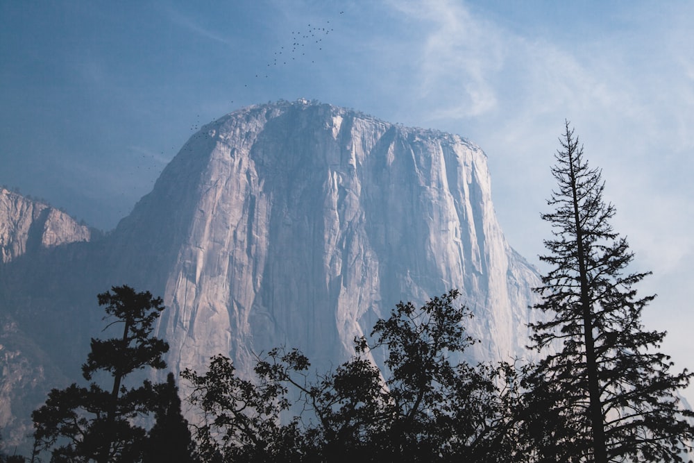 gray mountain under the blue sky during daytime