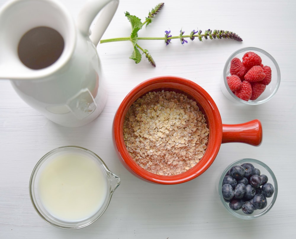 bowl of cereal near white pitcher