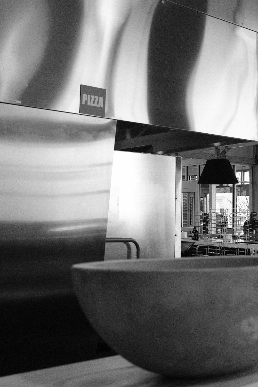 grayscale photo of bowl on table