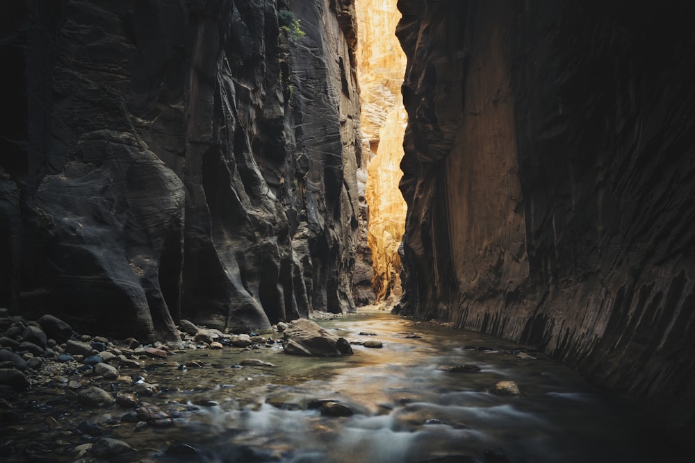 body of water on ridge between two rock formations