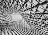 grayscale photo of metal mesh screen