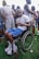 A man in a power wheelchair participating in a community event.