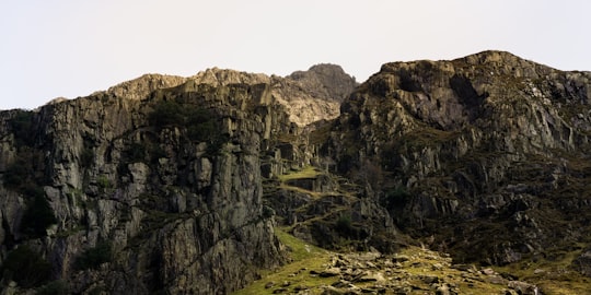 rock hill under cloudy sky during daytime in Snowdon United Kingdom