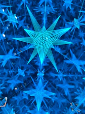 A deep navy blue background with delicate golden lines forming constellation-like neural networks.