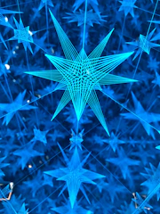 A deep navy blue background with delicate golden lines forming constellation-like neural networks.