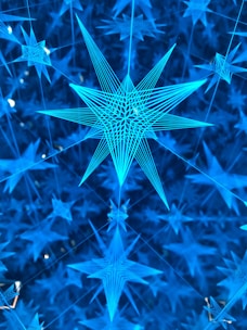 A delicate golden constellation pattern overlaying a dark blue background, symbolizing interconnected content.