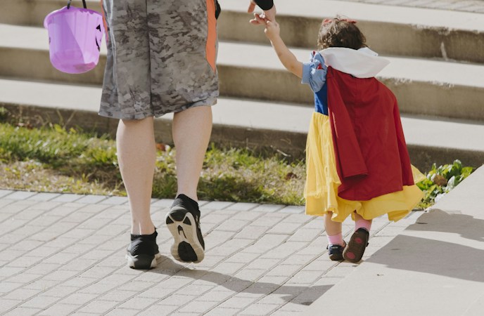 Toddler dressed in a Snow White costume, ready for a family Halloween event in Las Vegas
