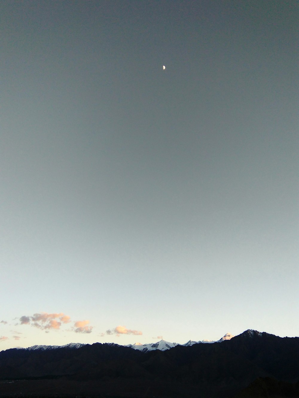 silhouette of mountain under gray sky