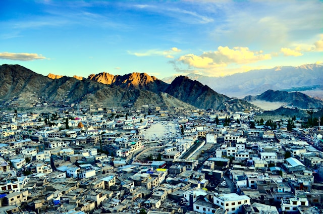 A picturesque landscape featuring serene valleys and vibrant cityscapes, capturing the essence of travel and exploration.