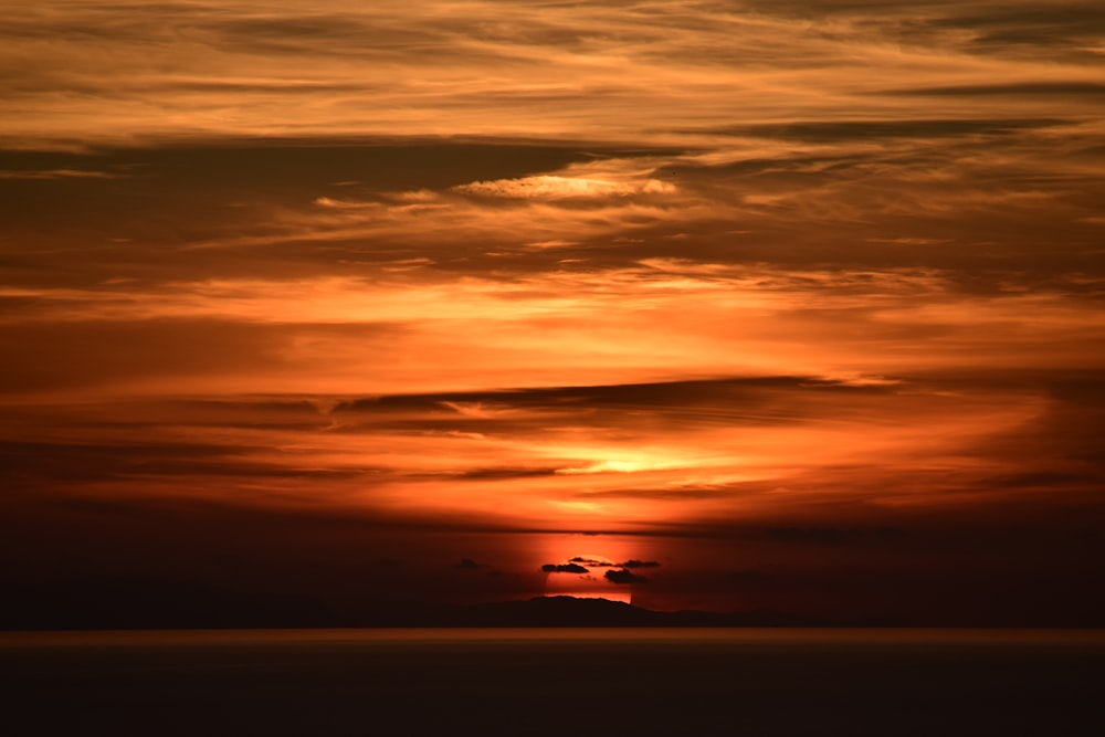 silhouette of clouds during golden hour